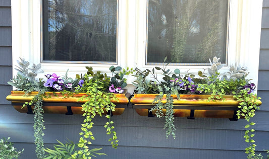 Set of 2 H Potter brand stainless steel window boxes with rustic copper finish hanging on outside of home