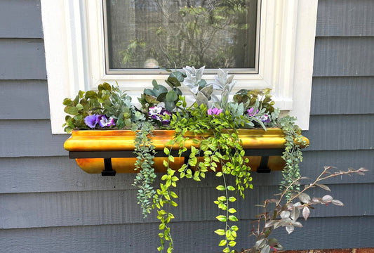 H Potter brand rustic copper window boxes plant containers hanging on outside of home with flowers