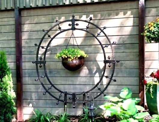 H Potter brand metal round garden trellis used as wall art outdoor with plants