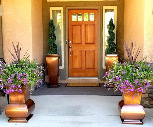H Potter brand metal garden planters in stainless steel with antique copper finish at home front door entryway