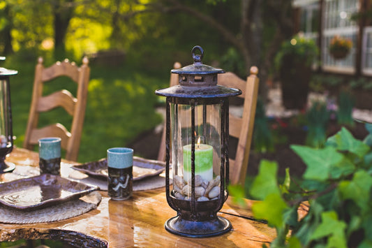 h Potter cast iron candle lantern on table for outdoor dining