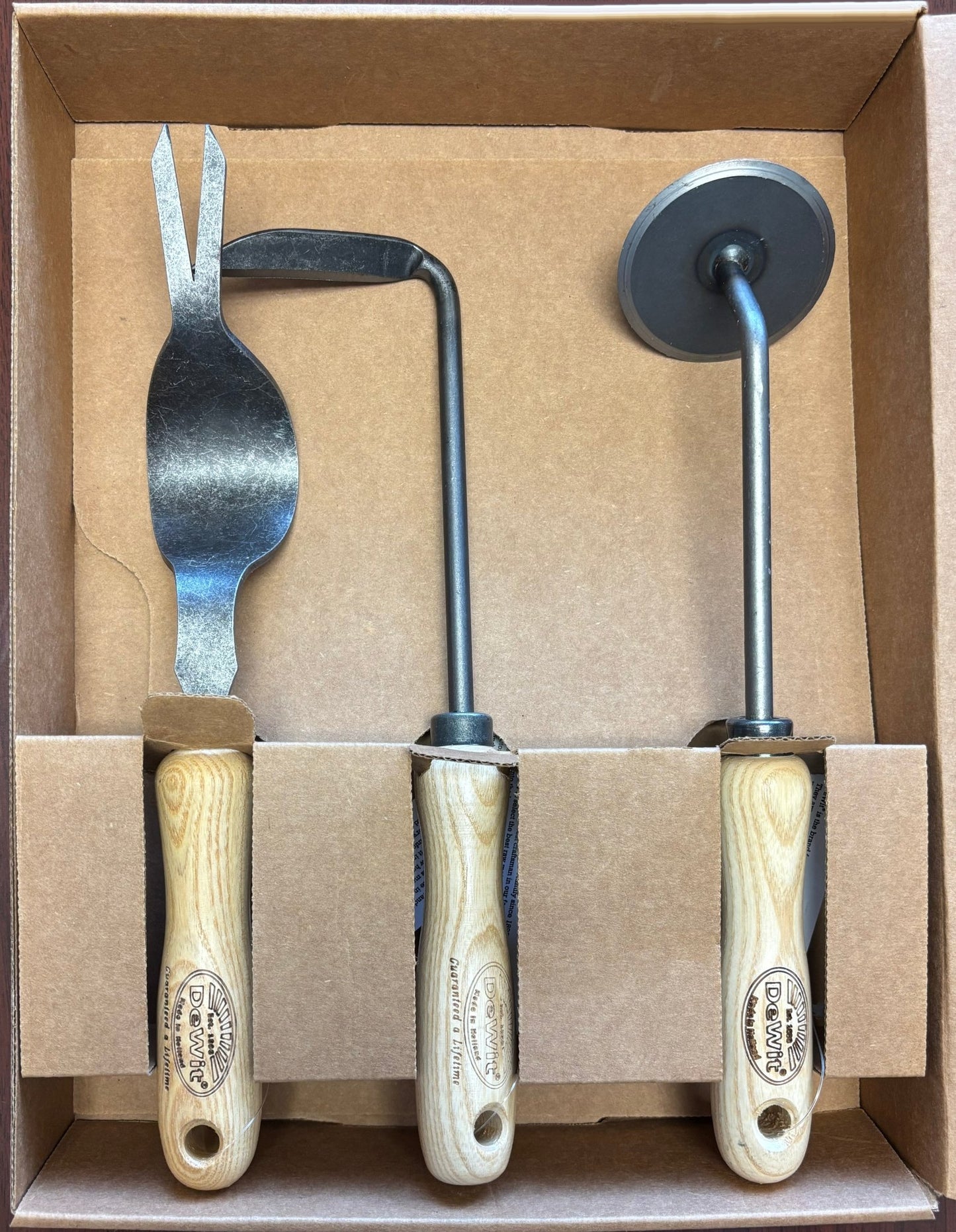 set of metal garden weeding tools with cutter, hoe and weedpopper in a box