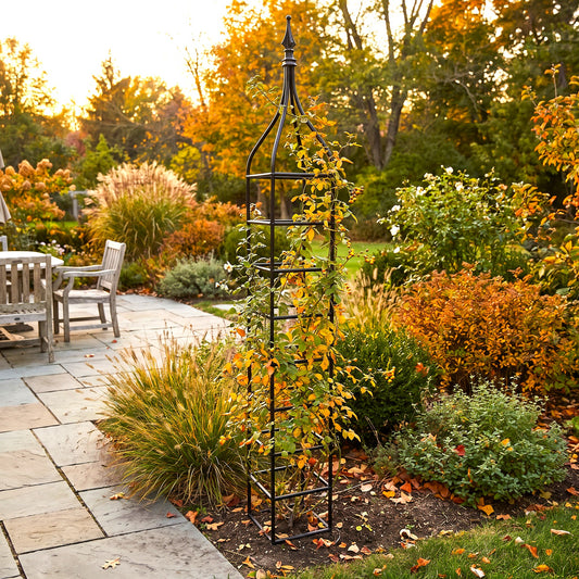 H Potter Rosemont black iron garden obelisk trellis supporting climbing plants in an autumn garden