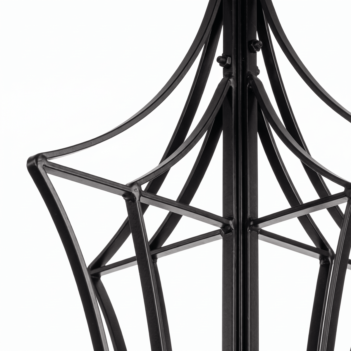 Close-up of Genie black garden obelisk trellis curved iron framework and construction