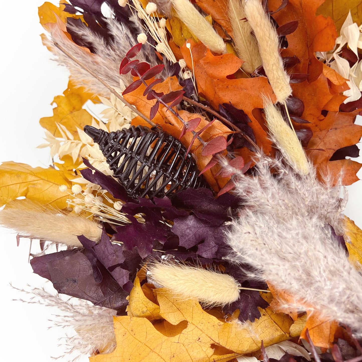 H Potter decorative wreath with autumnal elements including leaves and botanicals on a white background