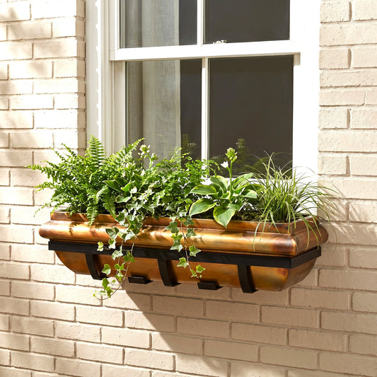 H Potter rustic copper window box with plants on outside of a house