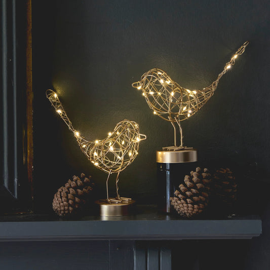 H Potter decorative wire bird with LED lights on a dark background
