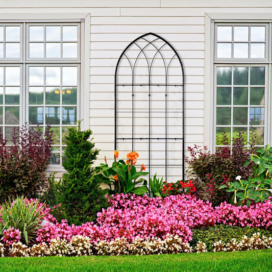 H Potter black gothic wrought iron garden trellis in a flower garden, freestanding vine support