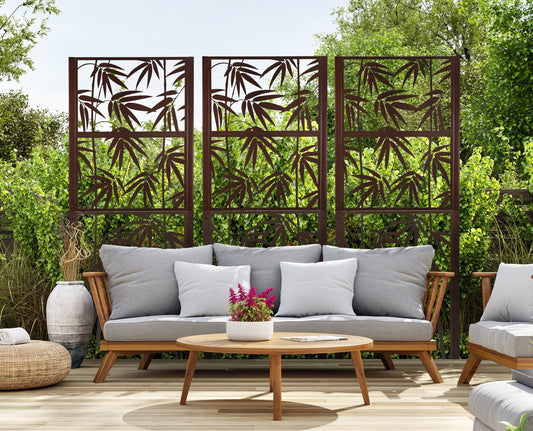 Set of 3 metal garden trellis privacy screens from H Potter on outdoor patio with bamboo leaf pattern