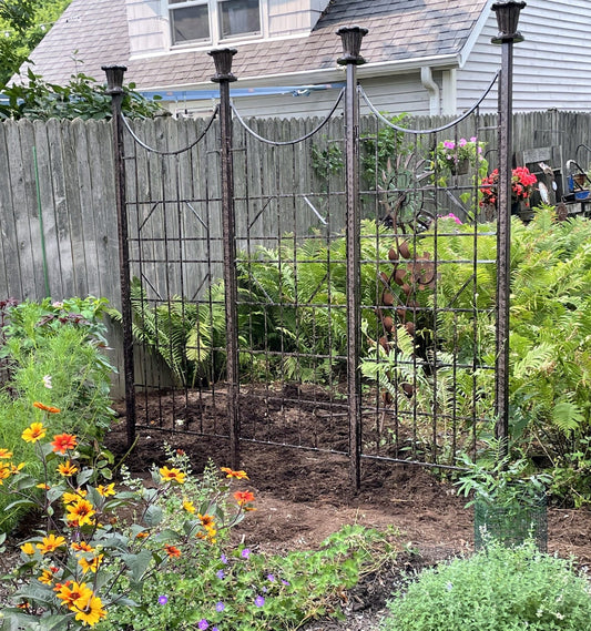 H Potter brand metal garden trellis screen with grid pattern outdoor landscape architectural structure in mulch