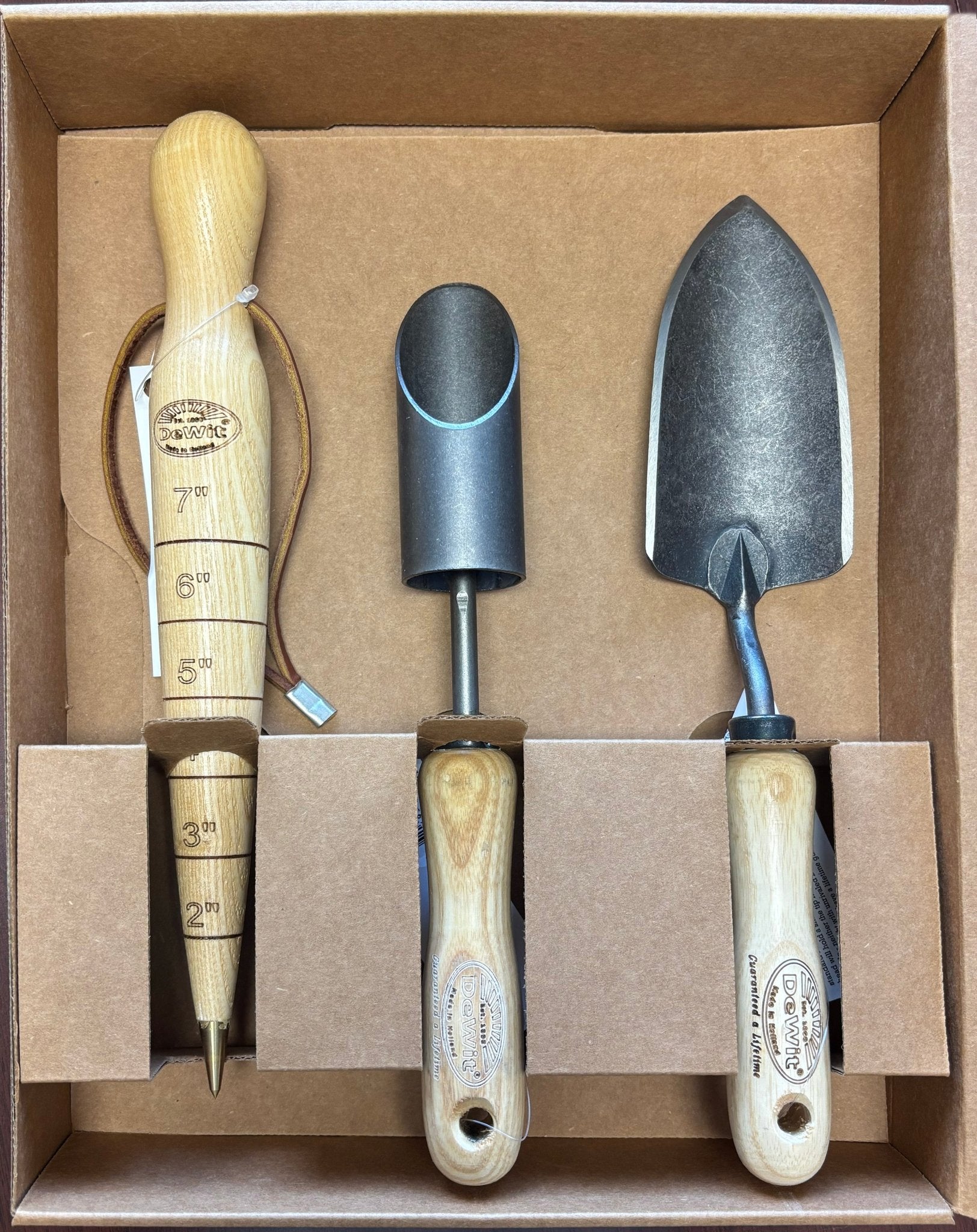 H Potter × DeWit 3-piece bulb planting tool gift set in presentation box featuring forged steel trowel, bulb planter, and hardwood dibber