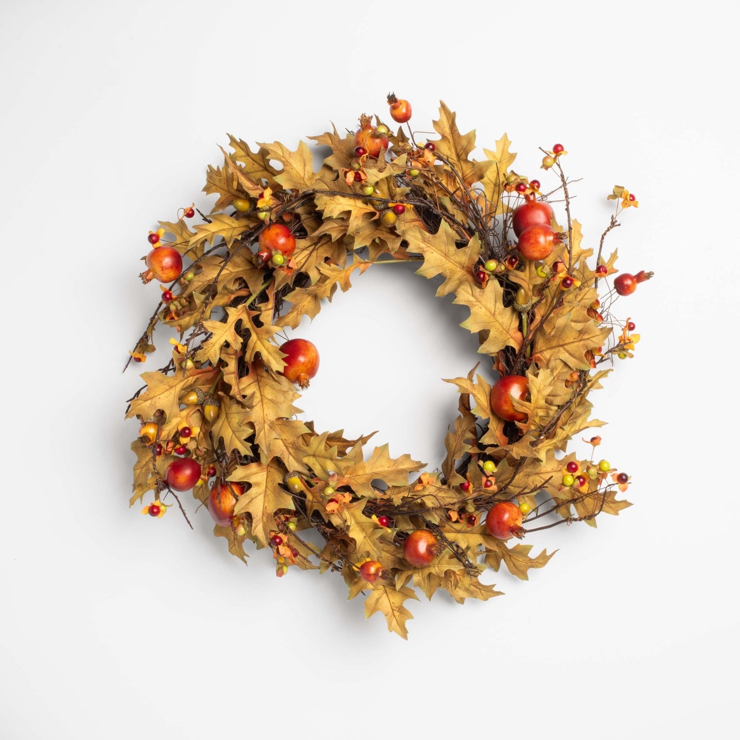 Autumn wreath with leaves and apples on a white background