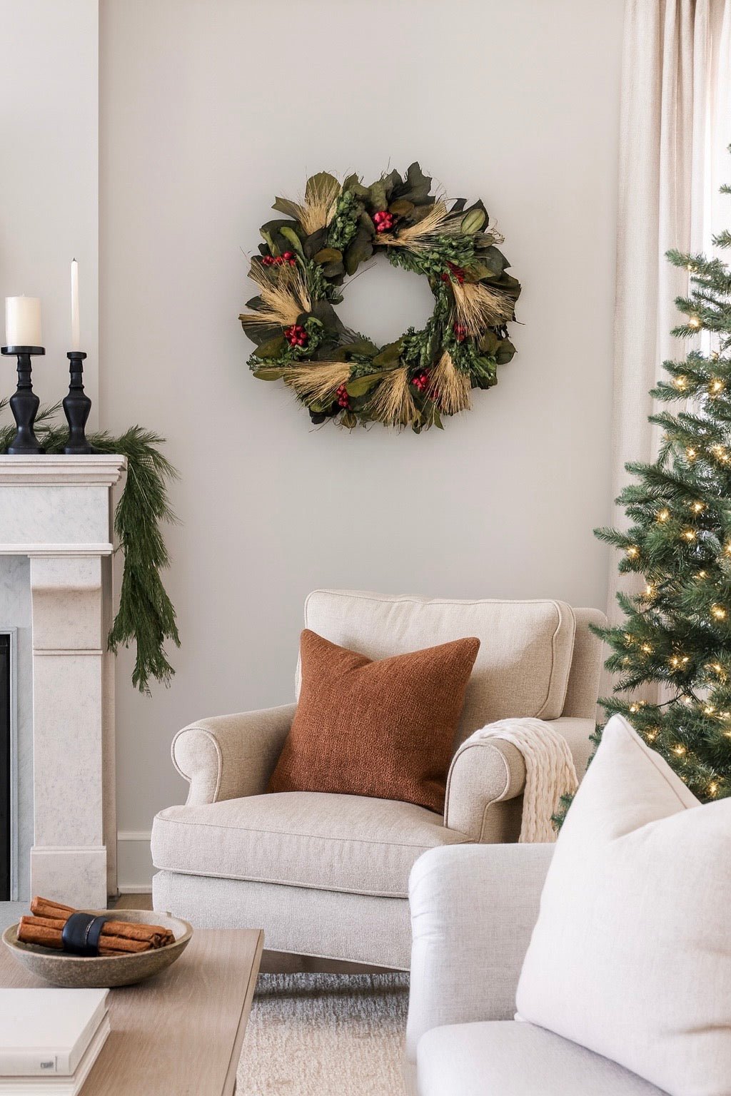 Christmas wreath with berries and wheat in a living room 