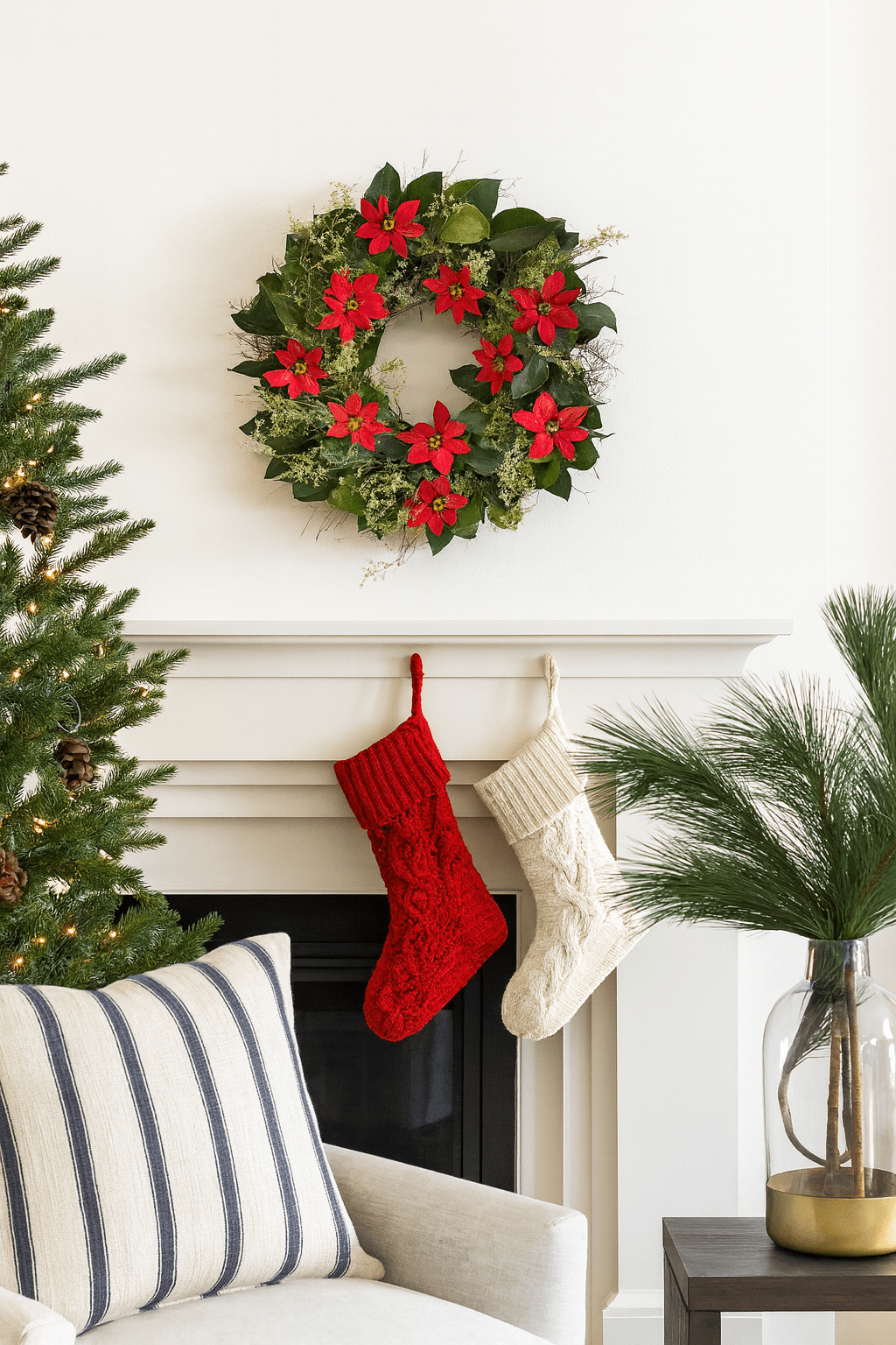 Christmas wreath with poinsettias above a mantle with stockings