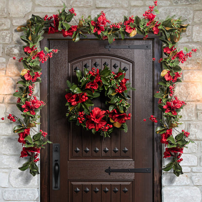 Decorative christmas wreath and garland on a door with stone wall background