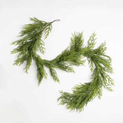 holiday cedar decorative garland on a white background 