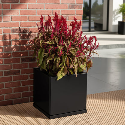 H Potter 17.5" Black Square Metal Planter with Drip Tray filled with red flower indoors