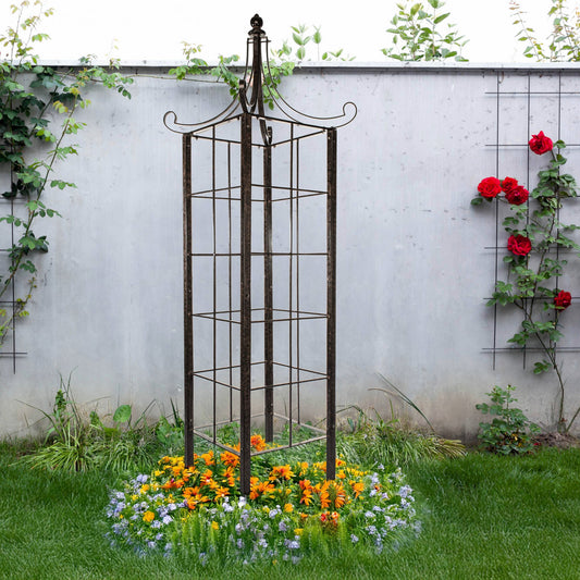 tall h potter architectural metal garden obelisk trellis in landscaped garden bed with flowers