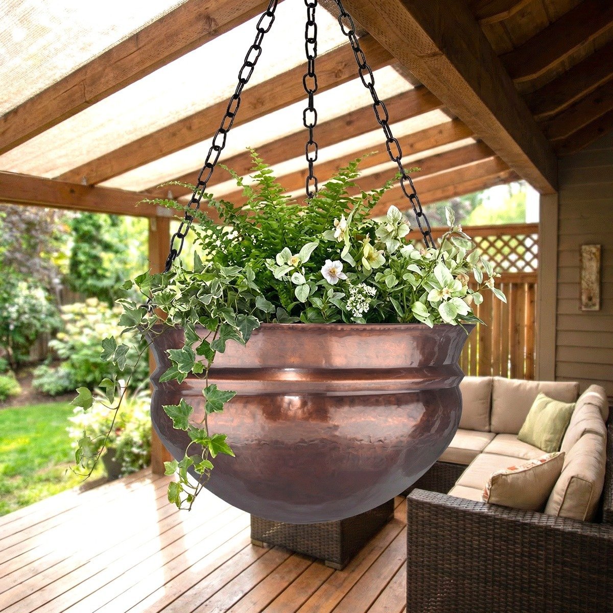 H Potter brass hanging planter with greenery on a wooden deck