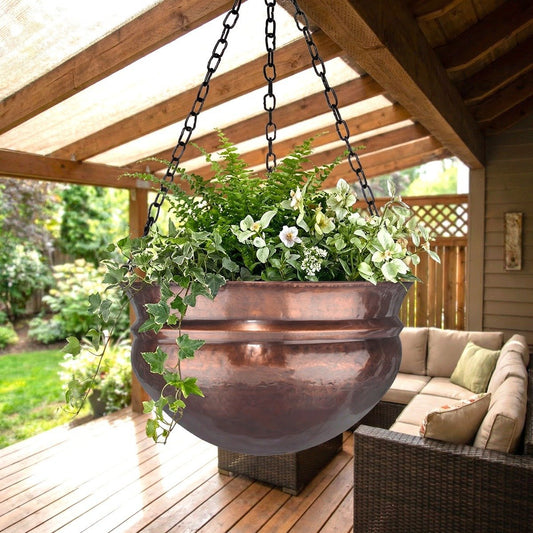 H Potter brass hanging planter with greenery on a wooden deck