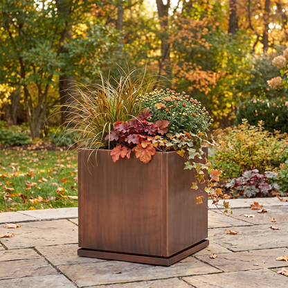 H Potter Ashbury 20-inch square antique copper planter with fall flowers on an outdoor patio
