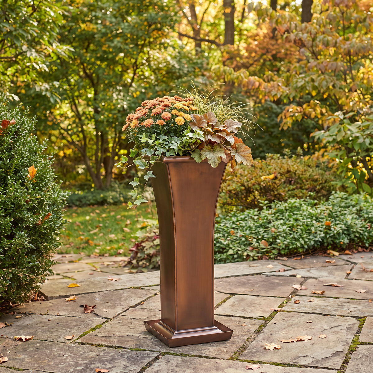 H Potter Ashford metal garden planter with fall flowers in an autumn garden