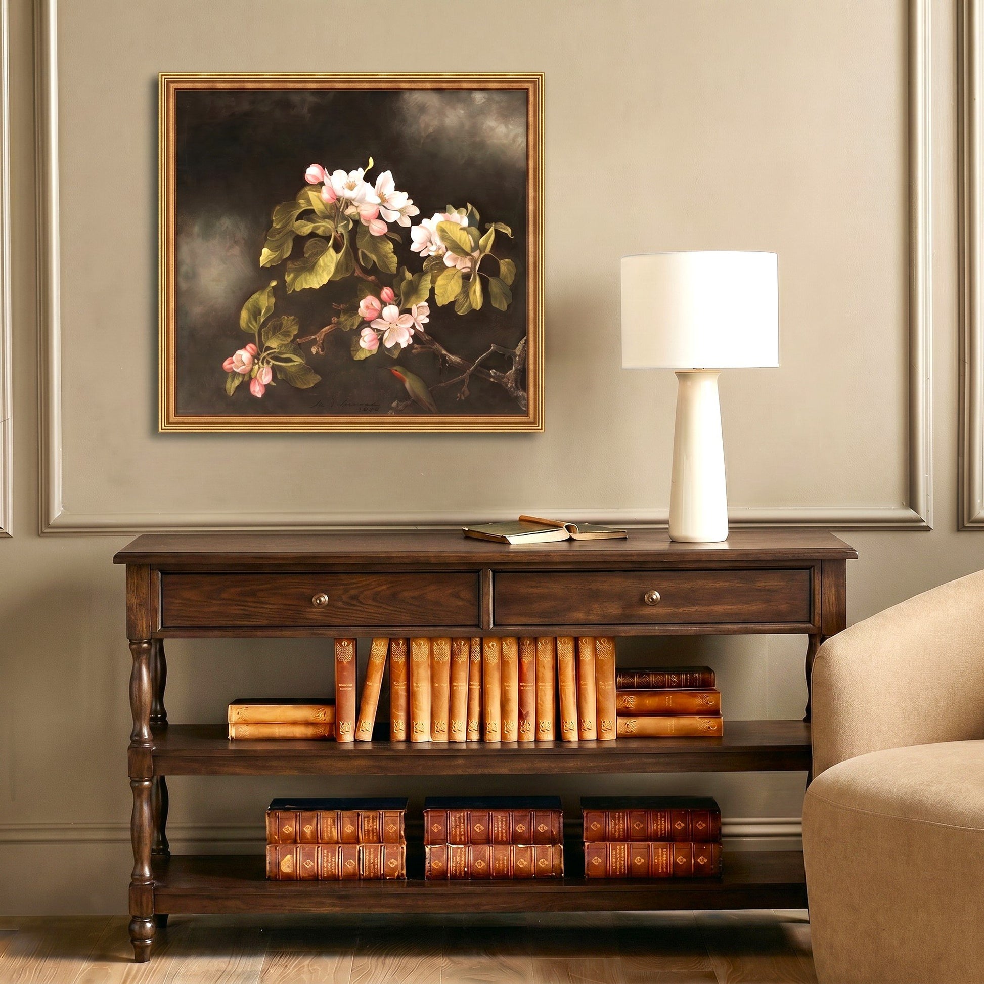 painting wall art over wooden console table with lamp and books