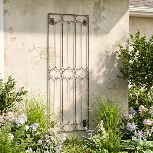 H Potter Carlisle Wall Trellis on a stucco house with plants below in the ground