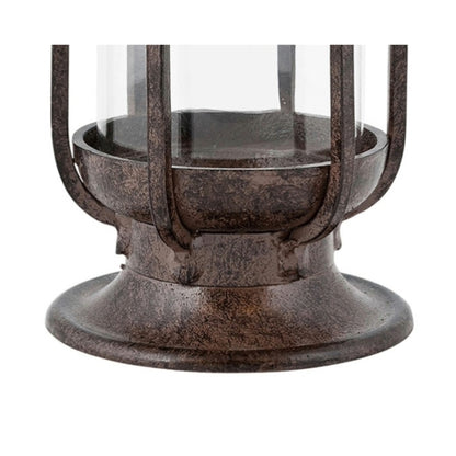 Close-up of the H Potter cast iron hurricane lantern base, showing metal texture, curved pedestal design, and lower glass cylinder.
