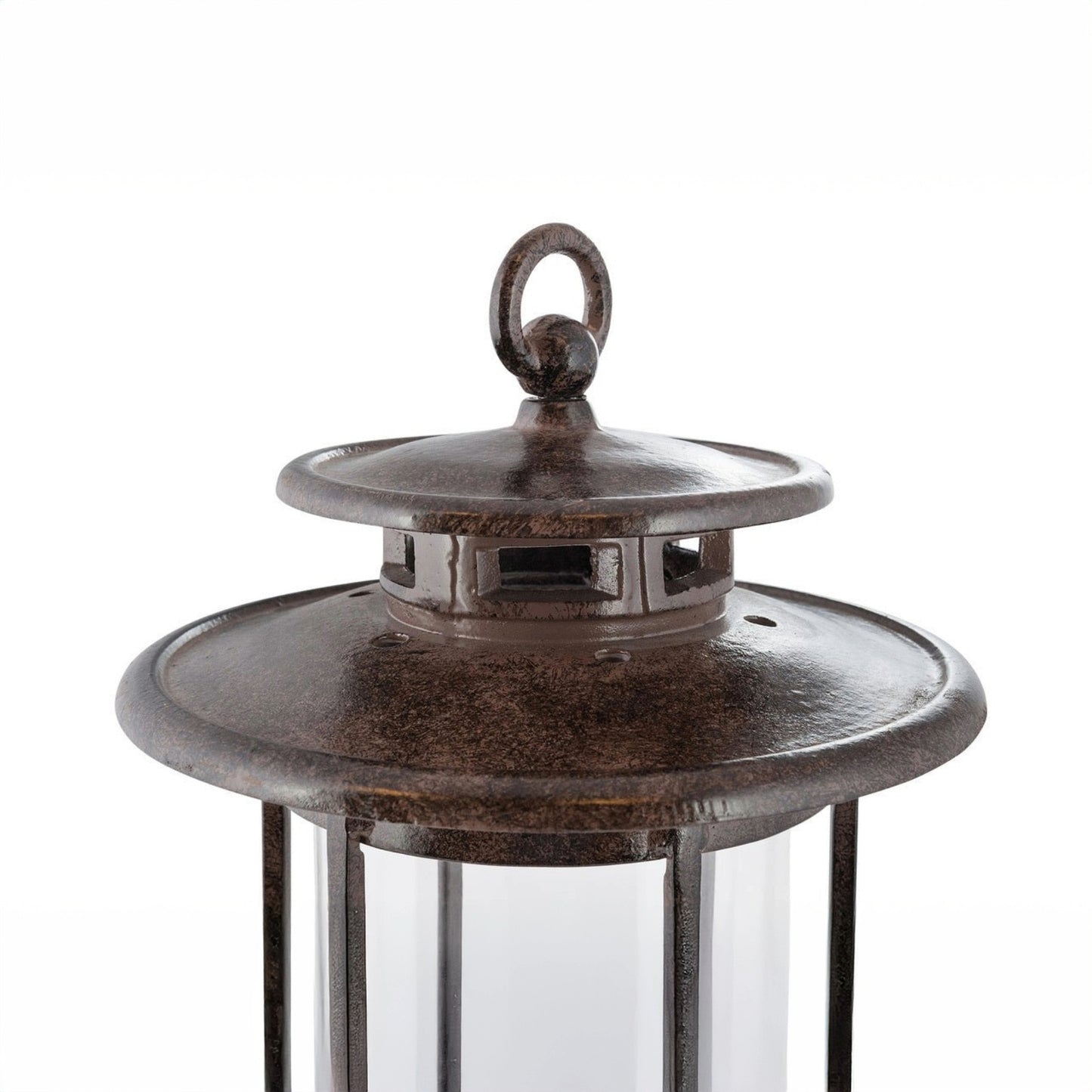 Close-up top detail of the H Potter cast iron hurricane lantern showing the vented metal lid and ring handle above the glass cylinder.