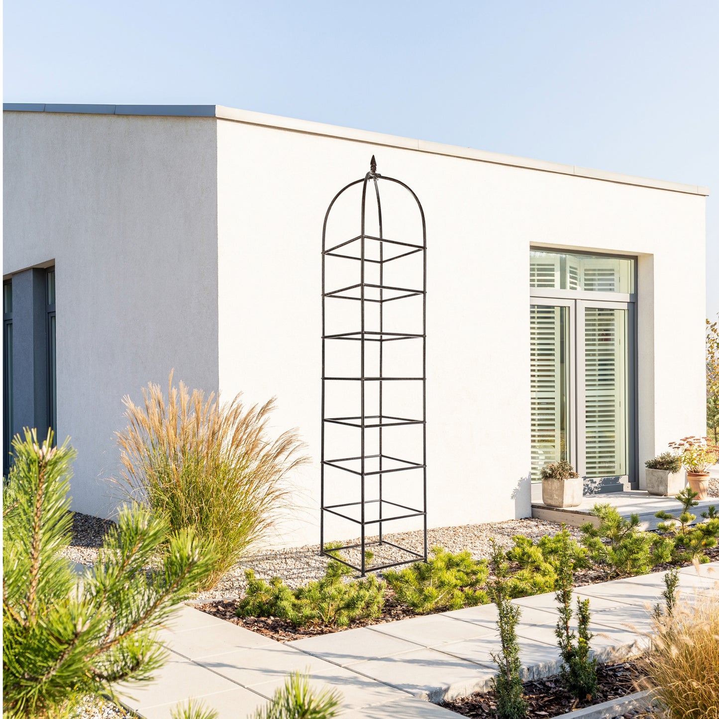 extra tall h potter chic farming obelisk trellis installed against modern home exterior
