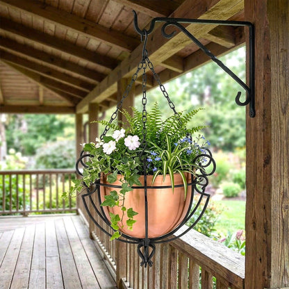 H Potter copper round hanging planter with flowers on a wooden porch
