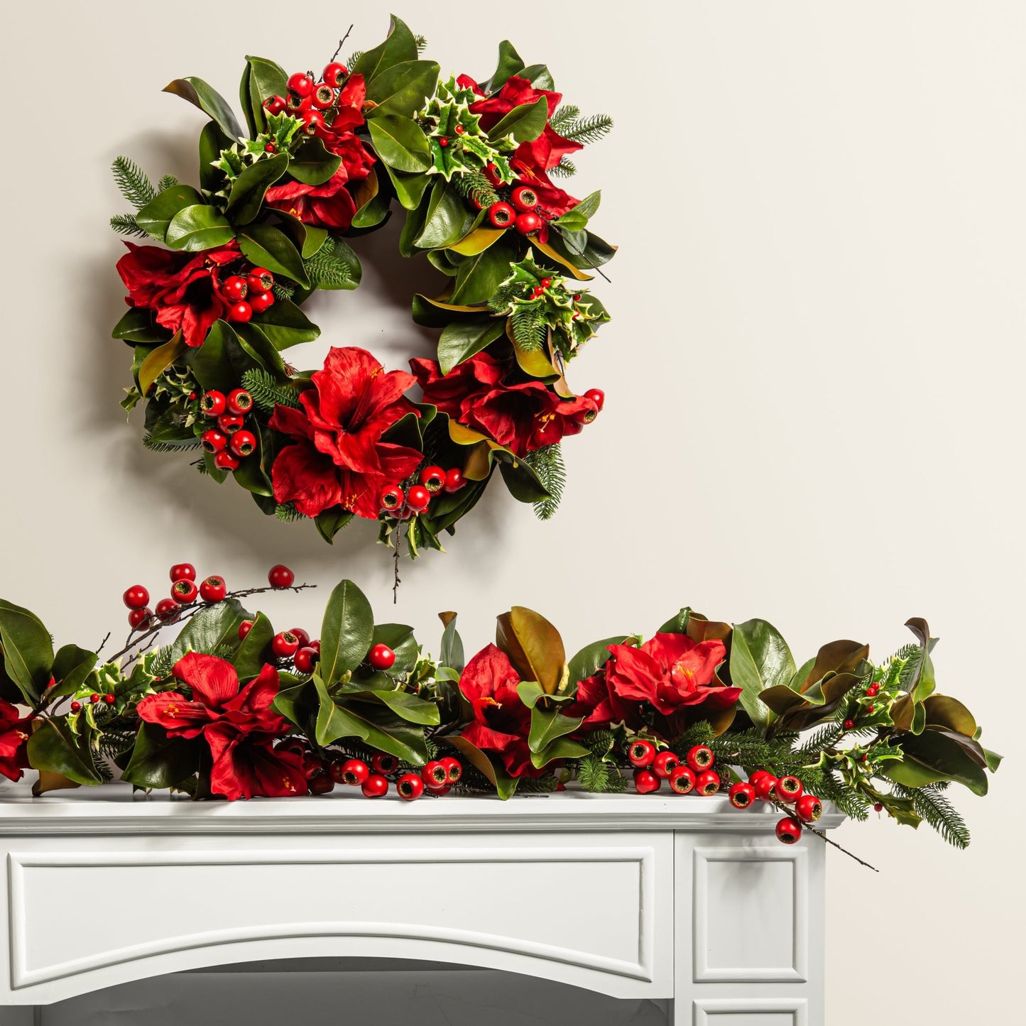 Christmas wreath and garland on a white surface with a neutral background