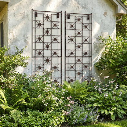 H Potter Delaney wall trellis on a house in a garden with green plants and hostas