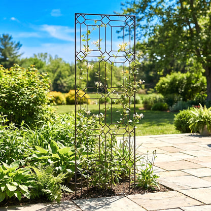 H Potter metal garden diamond trellis in mulch with green plants on stone patio