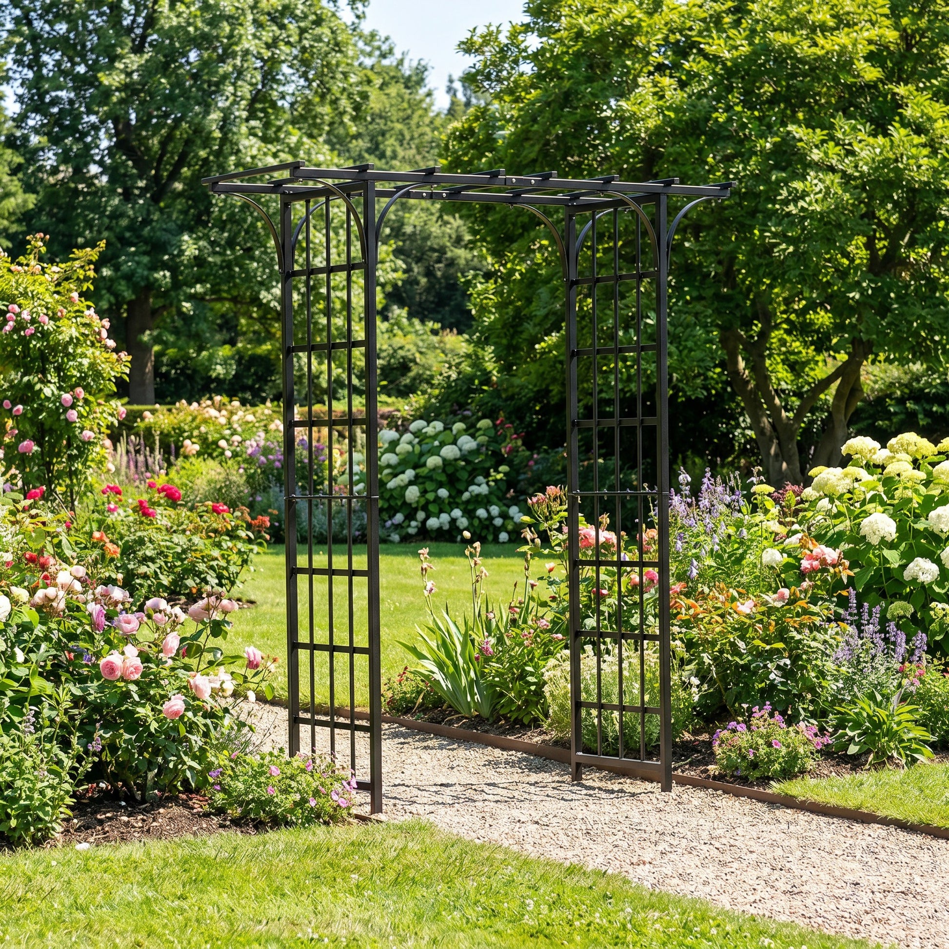H Potter metal garden archway in a lush garden with flowers and trees on a rock path