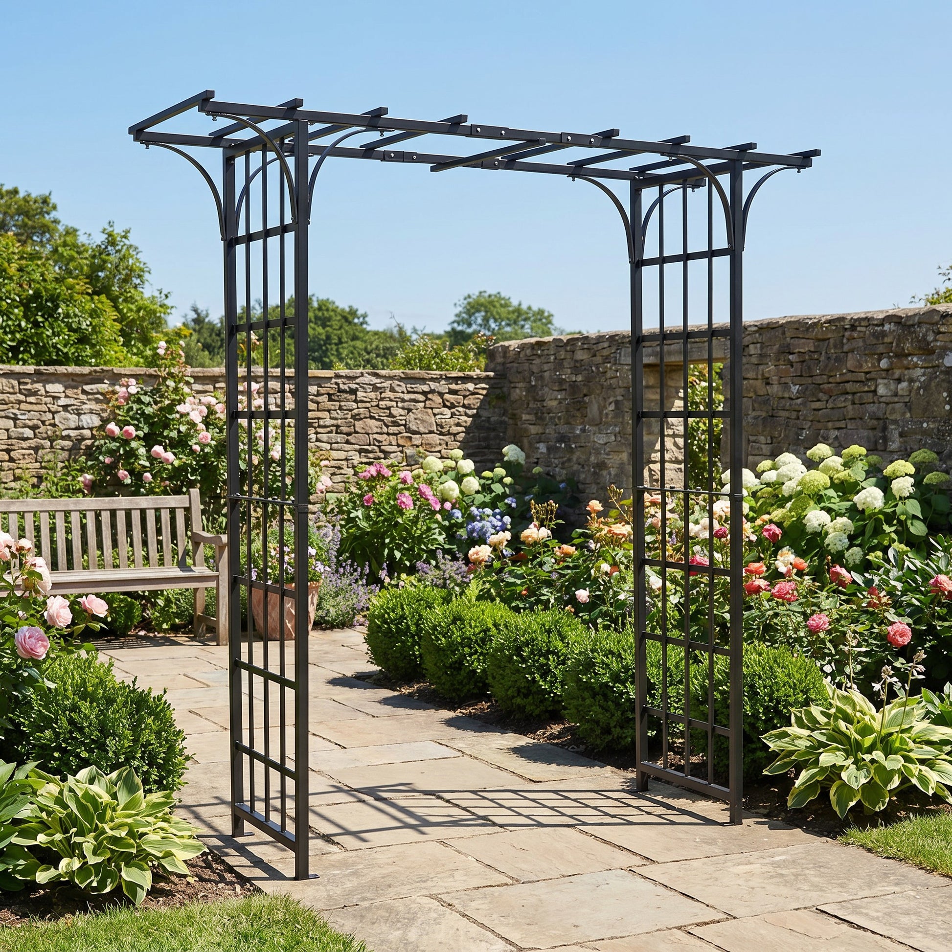 H POTTER eden park garden arbor in a garden setting with stone path and flowers