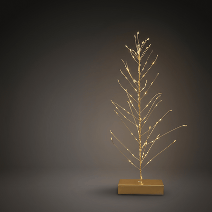 h potter gold wire tree light with small warm white LED bulbs on a rectangular gold base, photographed against a dark gray studio background.