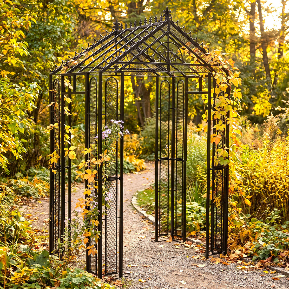 H Potter Marabella black iron garden arbor with climbing vines over an autumn garden pathway