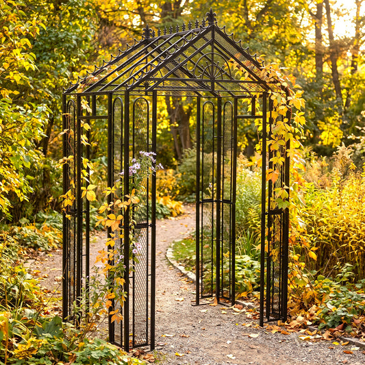 H Potter Marabella black iron garden arbor with climbing vines over an autumn garden pathway