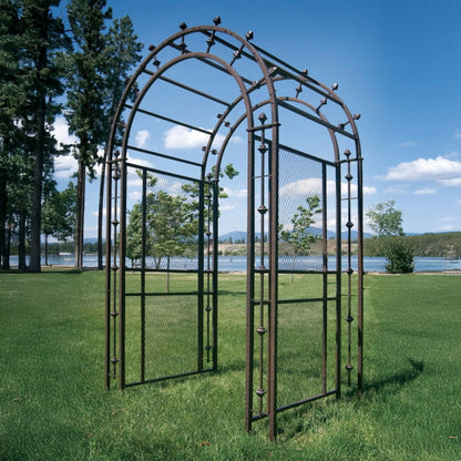 H Potter metal garden arbor trellis arch displayed on a lakeside lawn, designed for supporting climbing plants in outdoor spaces.