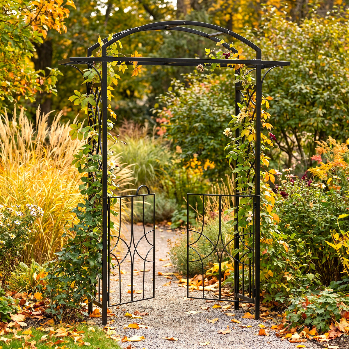 h potter black metal garden archway with two open gates and climbing vines, set in a lush autumn garden with yellow and green foliage.