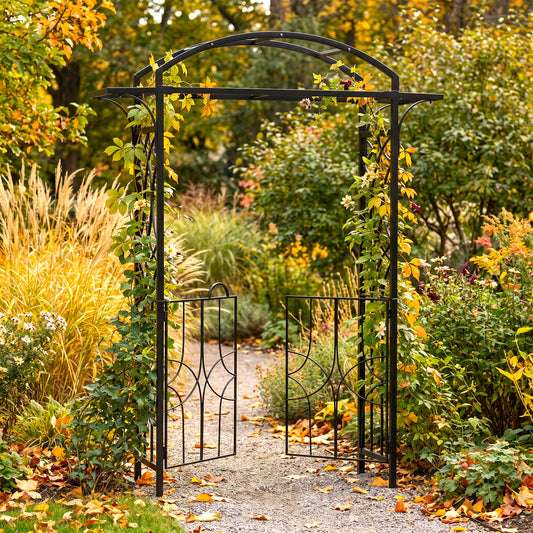 h potter black metal garden archway with two open gates and climbing vines, set in a lush autumn garden with yellow and green foliage.