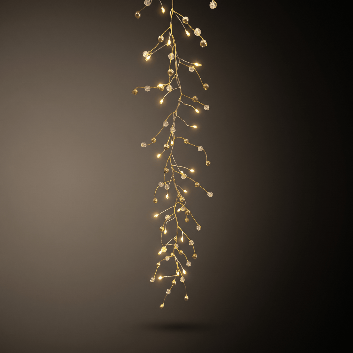 h potter warm white LED fairy string lights arranged in a cascading, branch-like drape against a dark gray gradient background.