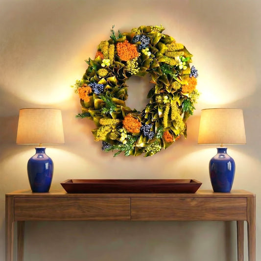 h potter golden meadow dried wreath on a wall above console table indoors