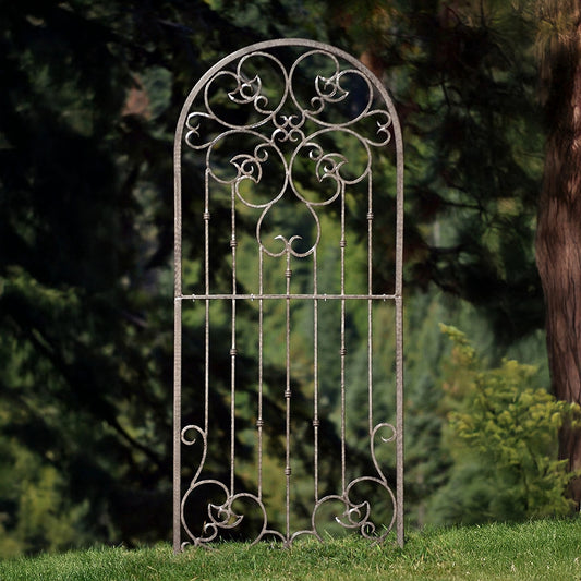 H Potter arched metal garden trellis with decorative scrollwork and charcoal brown finish standing outdoors for climbing plants.