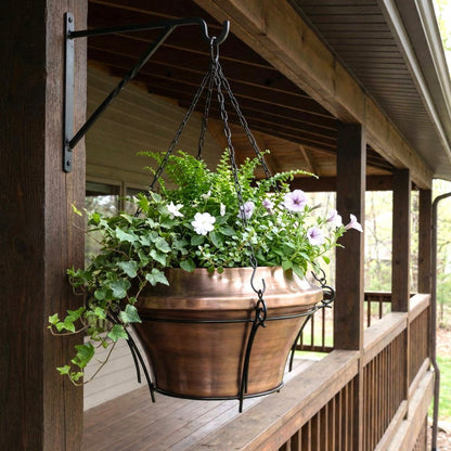 H Potter hanging copper planter with flowers on a wooden porch