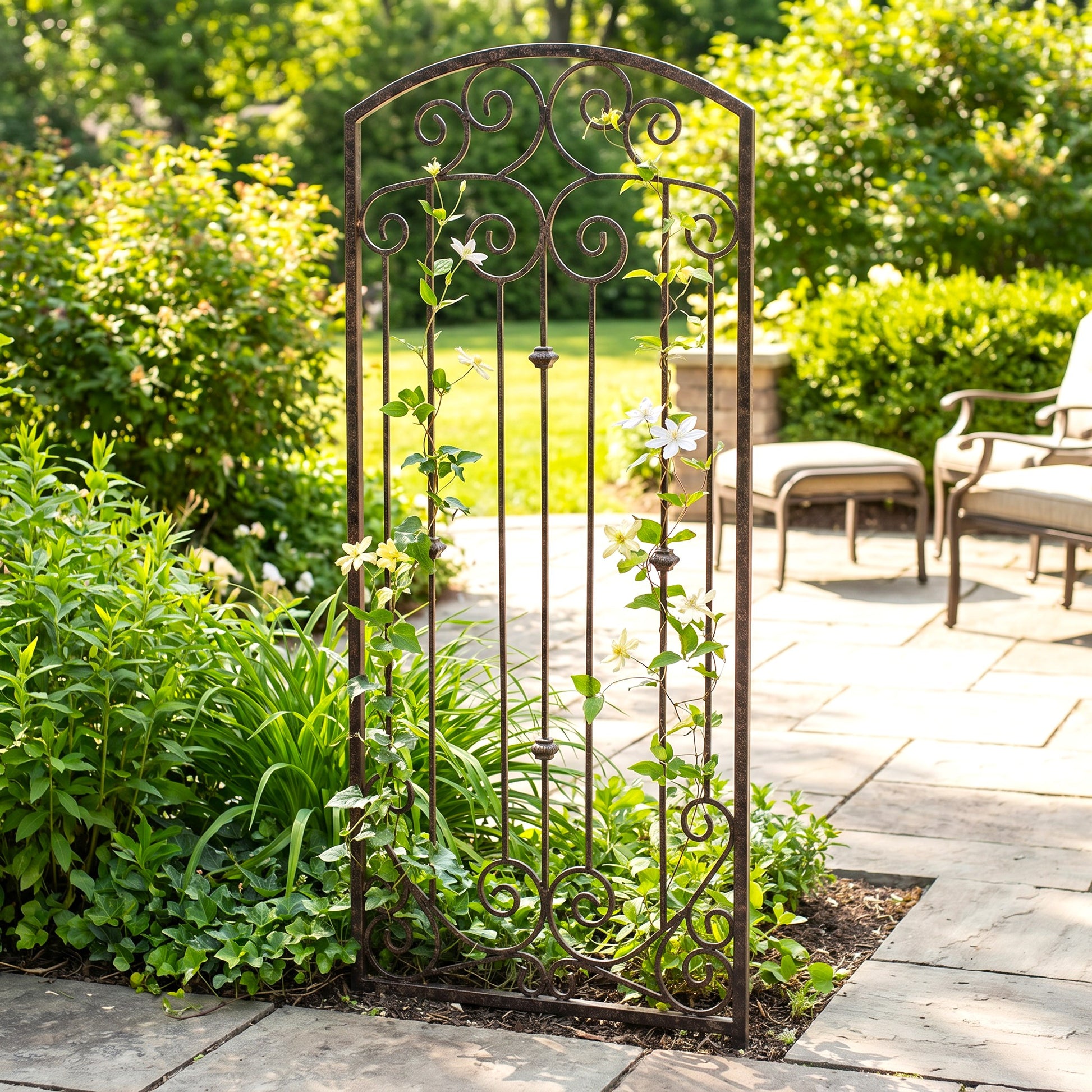 H Potter metal landscape trellis on stone patio with green plants ivy and clematis