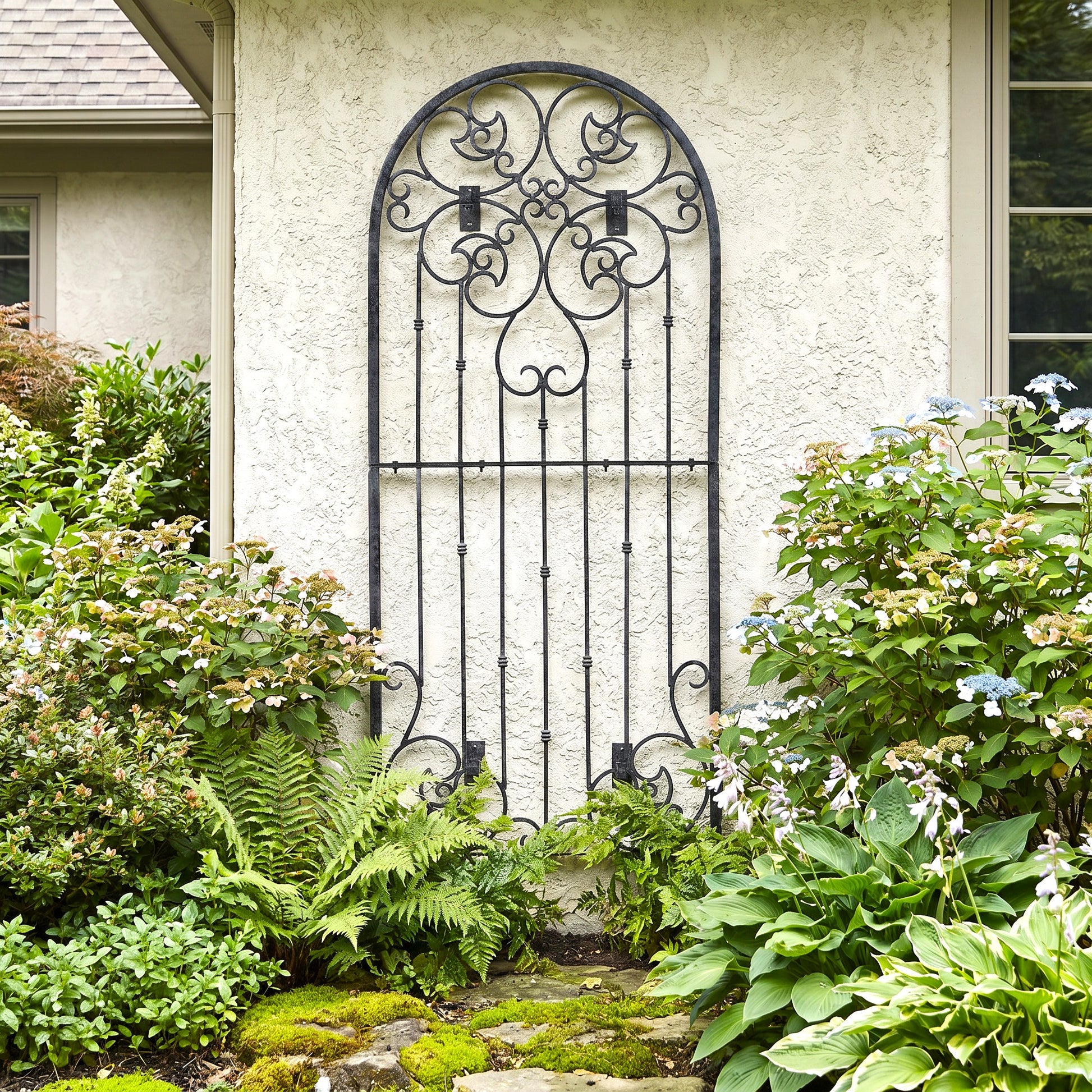 H Potter legacy wall trellis metal scrolls as wall art on a house