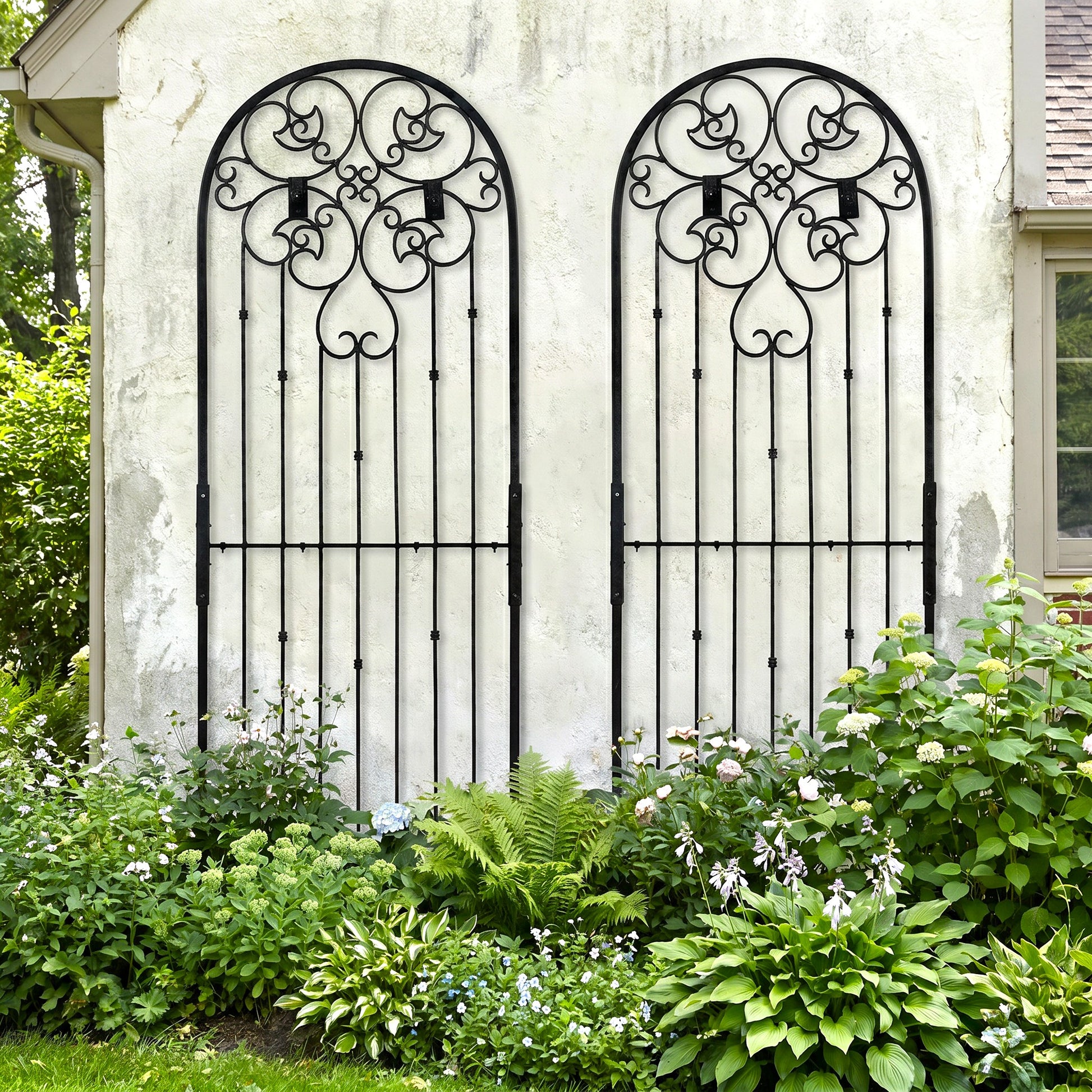 H Potter Legacy Wall trellis 8 ft tall black metal on stucco house above landscaped front yard garden